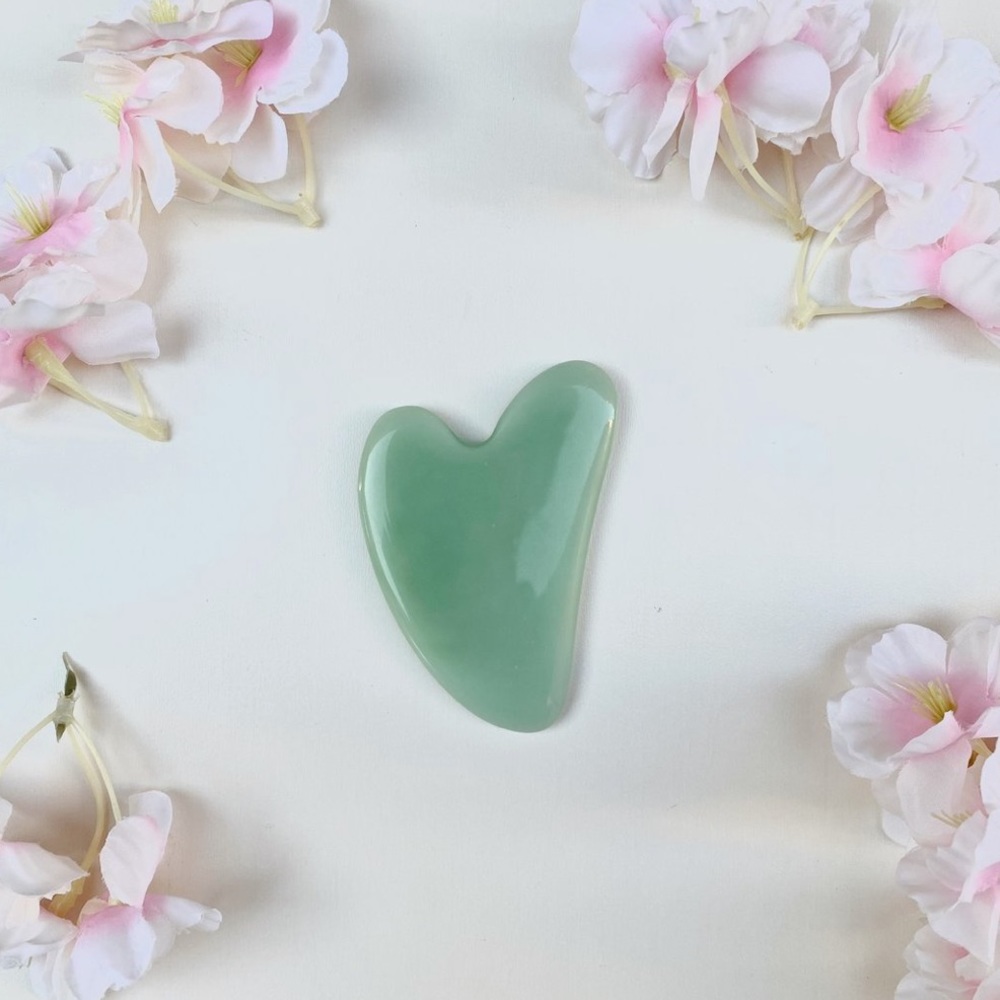 jade gua sha stone in green